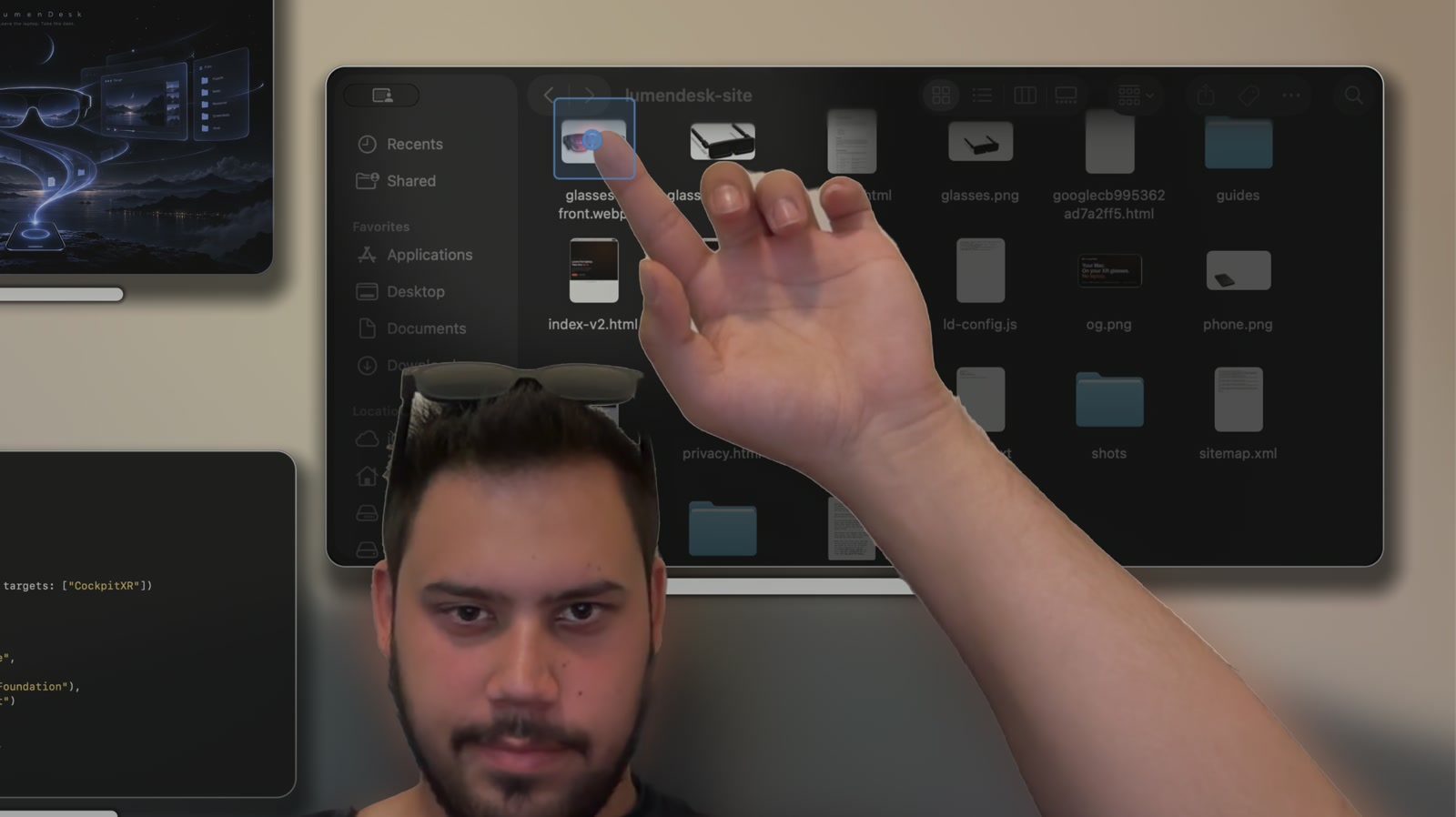 Pointing at a Finder icon inside a glass panel; the target magnet highlights it